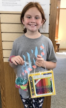 girl with library kit